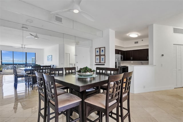 3400 NE 192nd St Unit Ph11, Aventura, FL 33180 - dining space featuring a ceiling fan