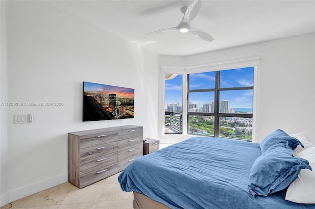 3400 NE 192nd St Unit Ph11, Aventura, FL 33180 - bedroom with multiple windows, baseboards, and ceiling fan