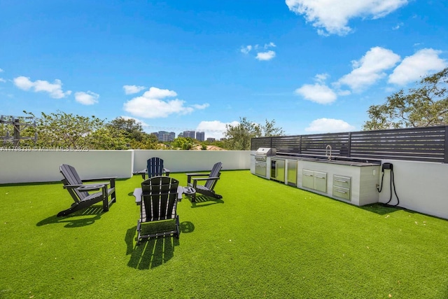 3224 Elizabeth St Unit 3224, Miami, FL 33133 - view of yard with exterior kitchen, a sink, and fence