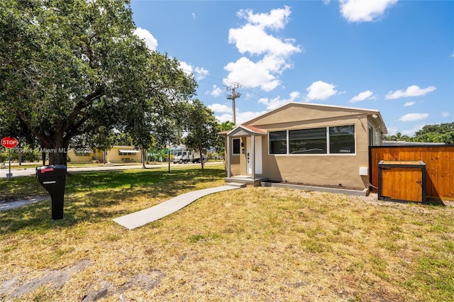 327 S 28th Ave, Hollywood, FL 33020 - view of front of home featuring a front yard and stucco siding