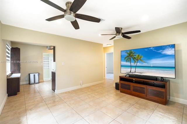 327 S 28th Ave, Hollywood, FL 33020 - unfurnished living room with a ceiling fan, light tile patterned flooring, and baseboards