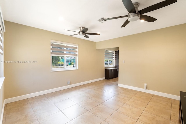 327 S 28th Ave, Hollywood, FL 33020 - empty room with a ceiling fan, light tile patterned floors, and baseboards