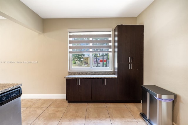327 S 28th Ave, Hollywood, FL 33020 - kitchen featuring dishwasher, dark brown cabinets, light tile patterned floors, and baseboards
