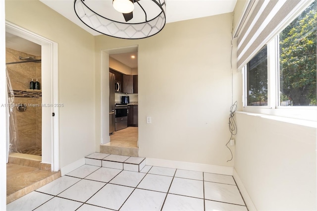 327 S 28th Ave, Hollywood, FL 33020 - corridor with light tile patterned floors and baseboards
