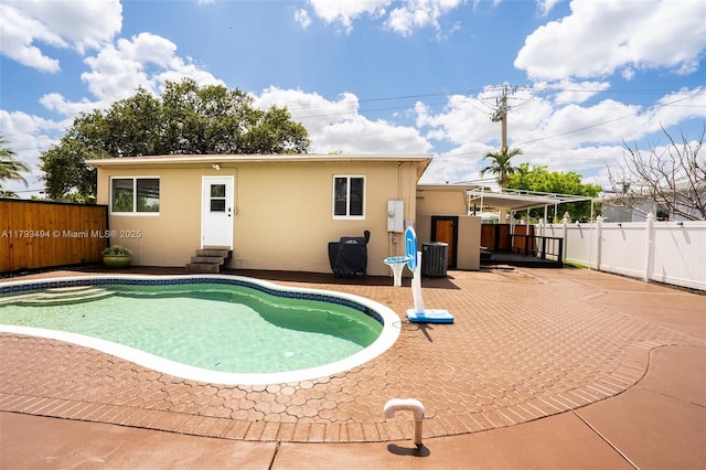 327 S 28th Ave, Hollywood, FL 33020 - view of swimming pool featuring entry steps, a patio, a fenced backyard, and cooling unit