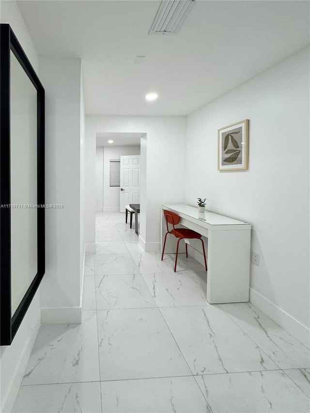 2966 NW 26th St, Miami, FL 33142 - corridor with marble look tile flooring, baseboards, and recessed lighting