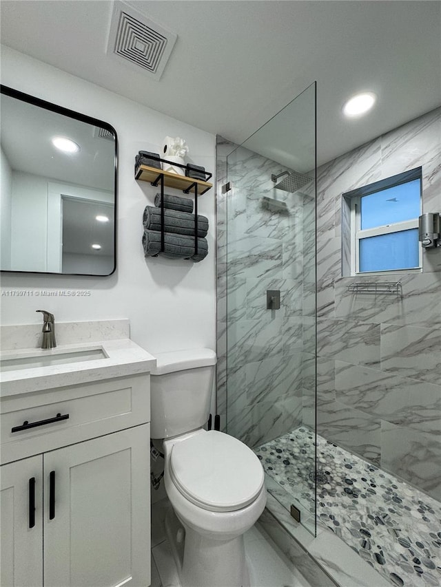 2966 NW 26th St, Miami, FL 33142 - full bath featuring toilet, a marble finish shower, vanity, recessed lighting, and marble finish floors