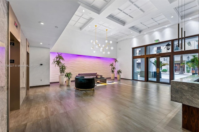 10 Aragon Ave Unit 1107, Coral Gables, FL 33134 - community lobby with a towering ceiling, coffered ceiling, and beamed ceiling