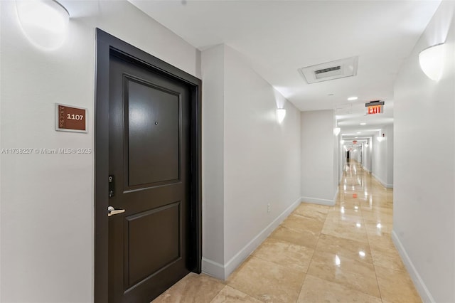 10 Aragon Ave Unit 1107, Coral Gables, FL 33134 - corridor featuring baseboards and light tile patterned floors