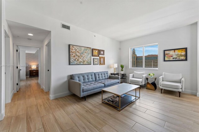 10 Aragon Ave Unit 1107, Coral Gables, FL 33134 - living area with light wood-type flooring and baseboards