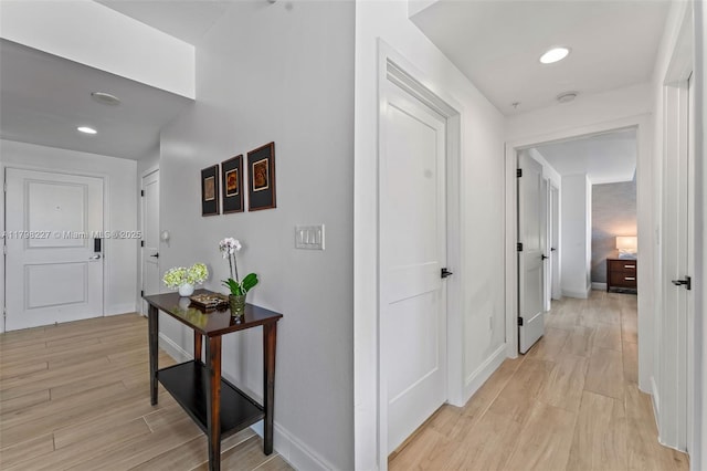 10 Aragon Ave Unit 1107, Coral Gables, FL 33134 - hall with light wood-style floors, baseboards, and recessed lighting