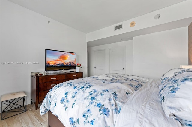 10 Aragon Ave Unit 1107, Coral Gables, FL 33134 - bedroom featuring light wood-type flooring