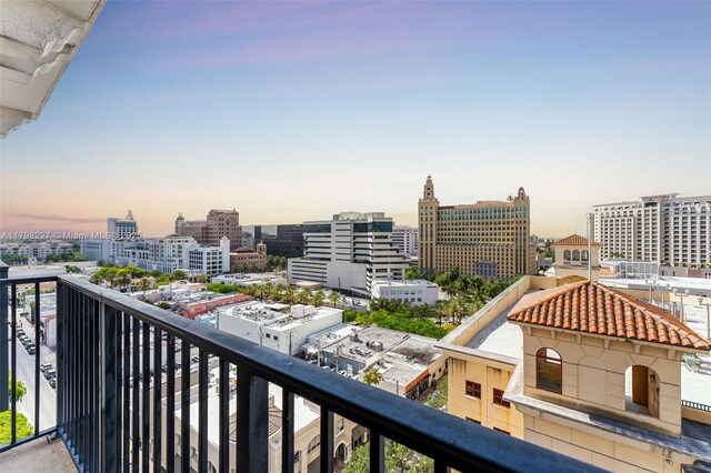 10 Aragon Ave Unit 1107, Coral Gables, FL 33134 - balcony at dusk featuring a city view