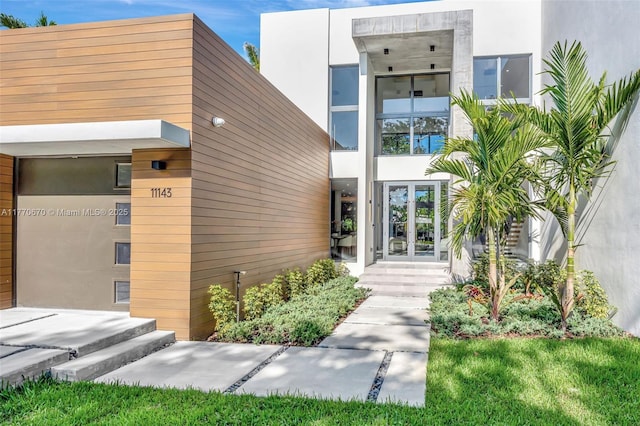 11143 NE 8th Ave, Biscayne Park, FL 33161 - property entrance featuring french doors and stucco siding