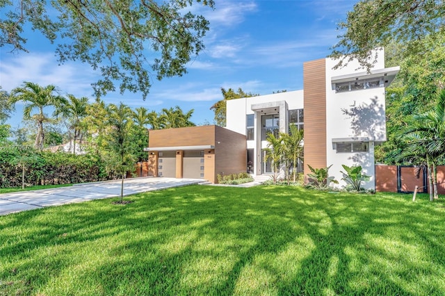 11143 NE 8th Ave, Biscayne Park, FL 33161 - contemporary home featuring a garage and a front lawn