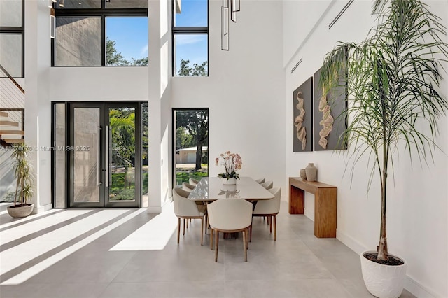 11143 NE 8th Ave, Biscayne Park, FL 33161 - dining area featuring a towering ceiling