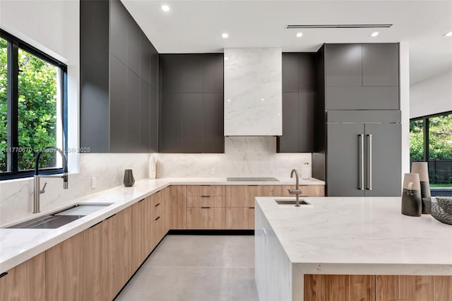11143 NE 8th Ave, Biscayne Park, FL 33161 - kitchen featuring modern cabinets, a sink, built in fridge, light brown cabinets, and recessed lighting