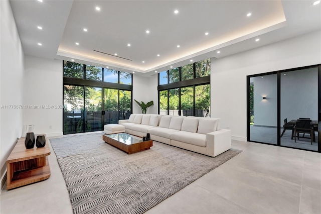 11143 NE 8th Ave, Biscayne Park, FL 33161 - living room with a raised ceiling, recessed lighting, a towering ceiling, and concrete floors