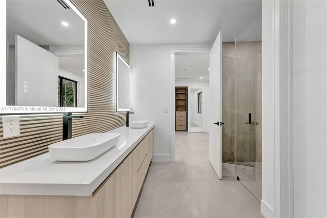 11143 NE 8th Ave, Biscayne Park, FL 33161 - bathroom with a stall shower, double vanity, recessed lighting, and finished concrete floors