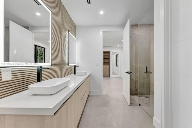 11143 NE 8th Ave, Biscayne Park, FL 33161 - bathroom with double vanity, a shower stall, recessed lighting, and finished concrete flooring