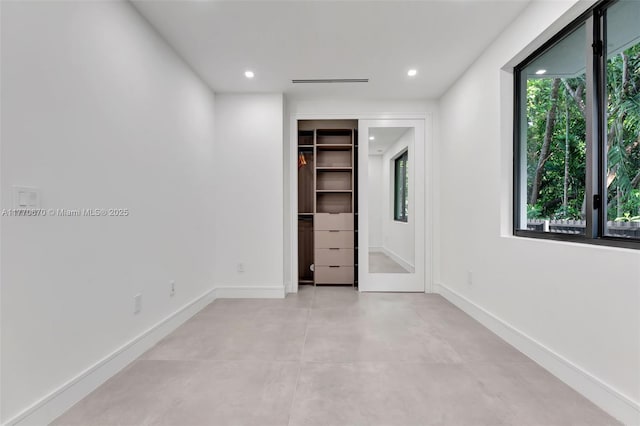 11143 NE 8th Ave, Biscayne Park, FL 33161 - unfurnished bedroom featuring multiple windows, recessed lighting, and baseboards