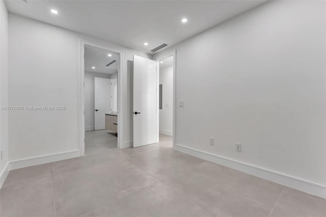 11143 NE 8th Ave, Biscayne Park, FL 33161 - unfurnished bedroom featuring recessed lighting, baseboards, and concrete flooring