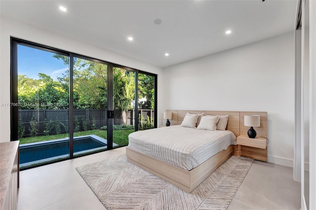 11143 NE 8th Ave, Biscayne Park, FL 33161 - bedroom with finished concrete flooring, recessed lighting, access to outside, and baseboards