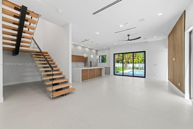 1320 NE 16th Ave, Fort Lauderdale, FL 33304 - unfurnished living room featuring a ceiling fan, stairs, recessed lighting, concrete flooring, and baseboards