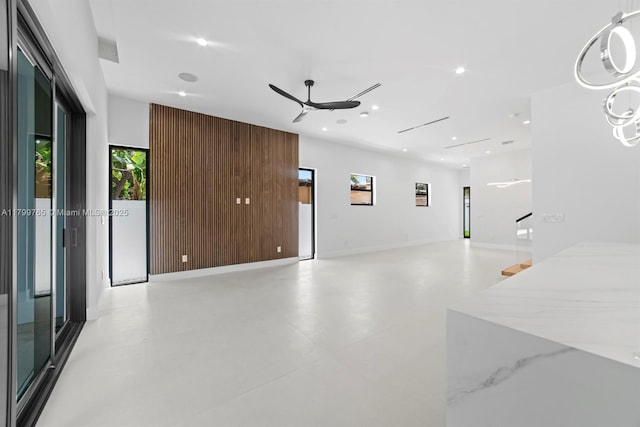 1320 NE 16th Ave, Fort Lauderdale, FL 33304 - unfurnished living room with plenty of natural light, ceiling fan, and recessed lighting