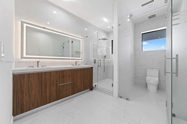 1320 NE 16th Ave, Fort Lauderdale, FL 33304 - bathroom featuring marble finish floors, a marble finish shower, toilet, and double vanity