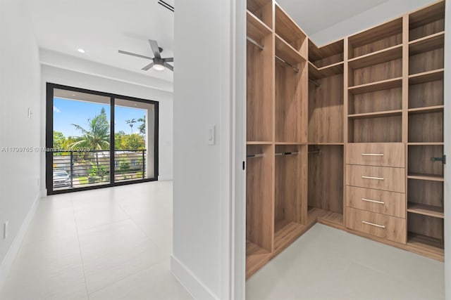 1320 NE 16th Ave, Fort Lauderdale, FL 33304 - spacious closet featuring ceiling fan and tile patterned floors
