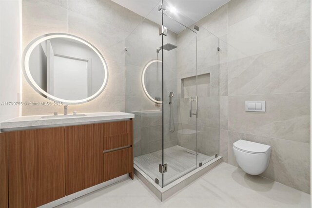 1320 NE 16th Ave, Fort Lauderdale, FL 33304 - full bath featuring tile walls, toilet, a stall shower, and vanity
