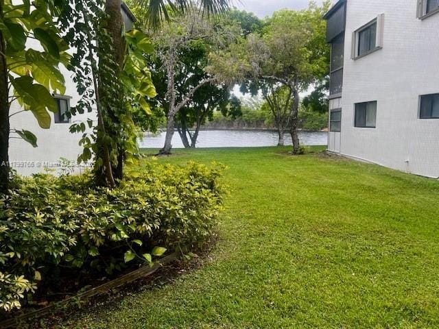 9920 NW 68th Pl Unit 103, Tamarac, FL 33321 - view of grassy yard with a water view