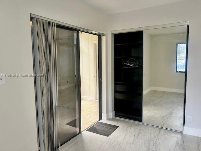 9920 NW 68th Pl Unit 103, Tamarac, FL 33321 - bathroom with baseboards