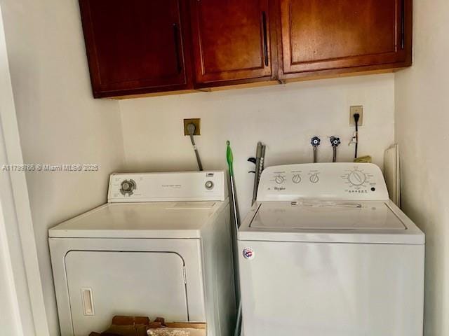 9920 NW 68th Pl Unit 103, Tamarac, FL 33321 - clothes washing area with independent washer and dryer and cabinet space