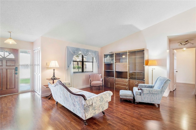 15827 Waverly Mnr, Davie, FL 33331 - living room featuring lofted ceiling, wood finished floors, a textured ceiling, and baseboards