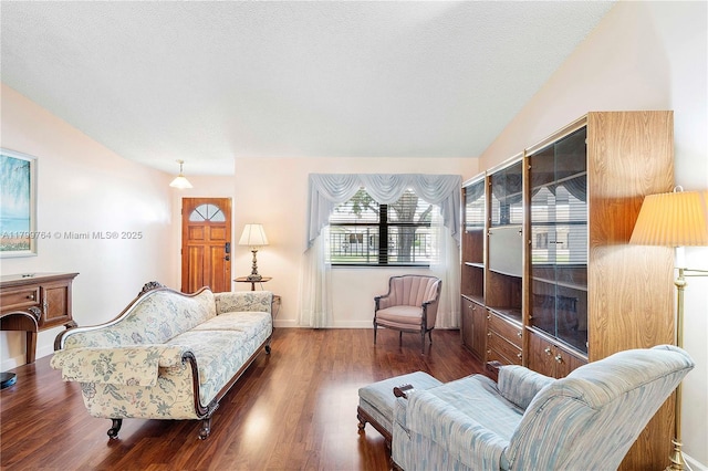 15827 Waverly Mnr, Davie, FL 33331 - living room featuring wood finished floors, lofted ceiling, baseboards, and a textured ceiling