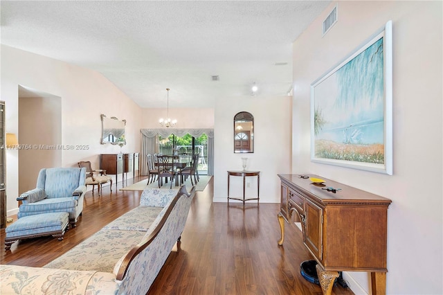 15827 Waverly Mnr, Davie, FL 33331 - living room with dark wood-style flooring, a chandelier, and a textured ceiling