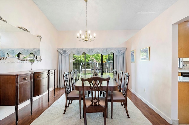 15827 Waverly Mnr, Davie, FL 33331 - dining area featuring wood finished floors, a chandelier, and baseboards