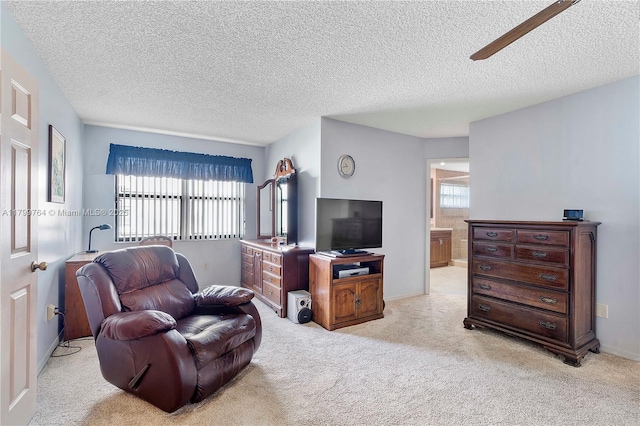 15827 Waverly Mnr, Davie, FL 33331 - living area with a textured ceiling, light carpet, baseboards, and ceiling fan