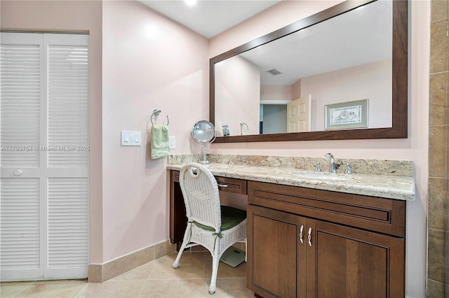 15827 Waverly Mnr, Davie, FL 33331 - bathroom featuring a closet, vanity, baseboards, and tile patterned flooring