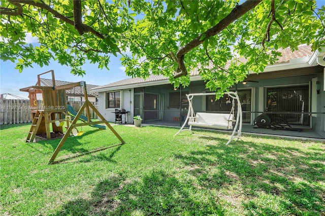 15827 Waverly Mnr, Davie, FL 33331 - rear view of property with a playground, a sunroom, and stucco siding