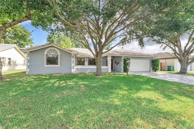 15827 Waverly Mnr, Davie, FL 33331 - view of front facade featuring an attached garage, driveway, stucco siding, and a front yard