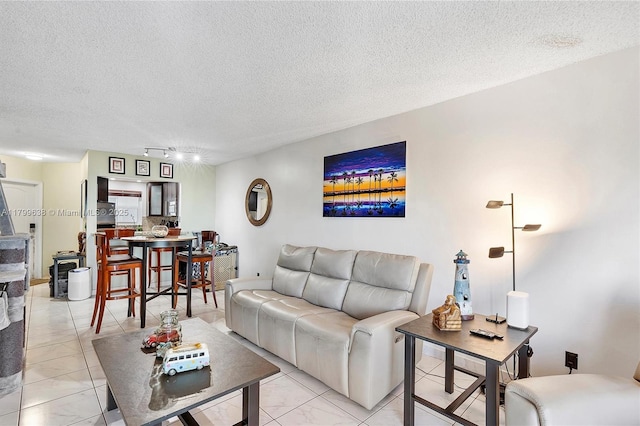 1750 W 46th St Unit 528, Hialeah, FL 33012 - living room with a textured ceiling, track lighting, and light marble finish floors