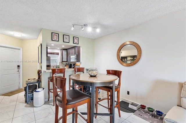 1750 W 46th St Unit 528, Hialeah, FL 33012 - dining space featuring a textured ceiling