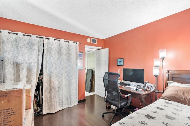 1750 W 46th St Unit 528, Hialeah, FL 33012 - bedroom with wood finished floors, an office area, and a textured ceiling