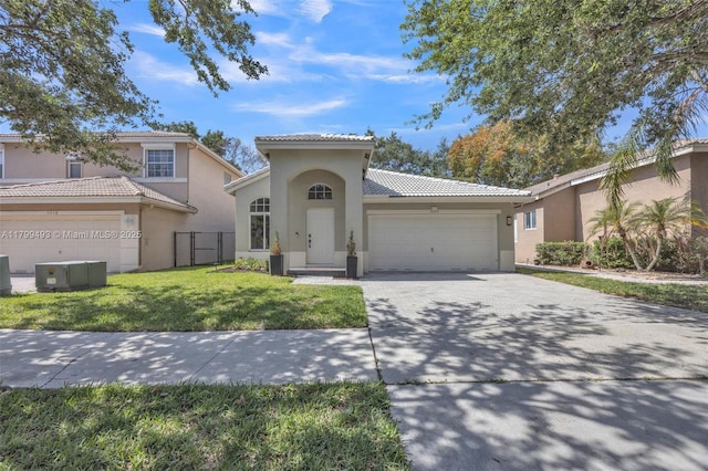 5020 Ibis Ct, Coconut Creek, FL 33073 - mediterranean / spanish-style house with an attached garage, stucco siding, a tile roof, and driveway
