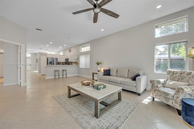 5020 Ibis Ct, Coconut Creek, FL 33073 - living area with light tile patterned floors, healthy amount of natural light, a ceiling fan, and recessed lighting