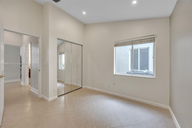 5020 Ibis Ct, Coconut Creek, FL 33073 - unfurnished bedroom featuring light tile patterned flooring, baseboards, recessed lighting, and a closet