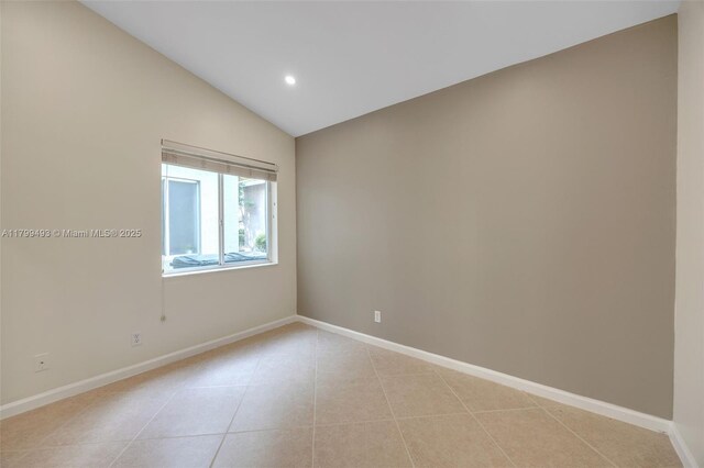 5020 Ibis Ct, Coconut Creek, FL 33073 - empty room with lofted ceiling, light tile patterned flooring, baseboards, and recessed lighting